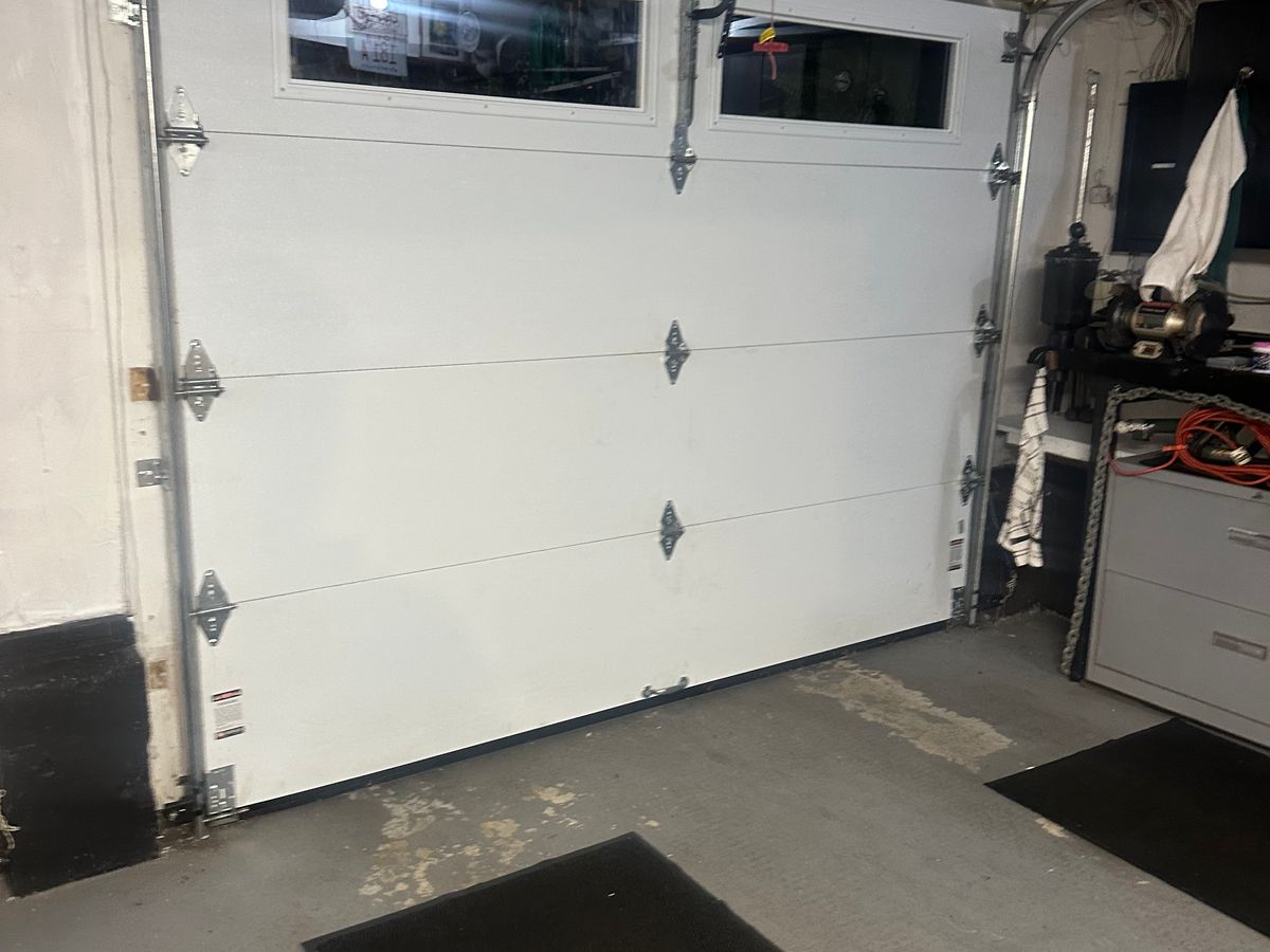 Commercial garage door interior with window and hardware — MA installation